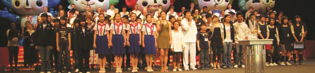 WYC performing with Jackie Chan at the Opening ceremonies of the Olympic Equestrian Games in Hong Kong - Jean-Claude Wilkens © Foundation World Youth Choir 